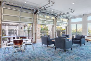 clubhouse with firehouse style garage doors
